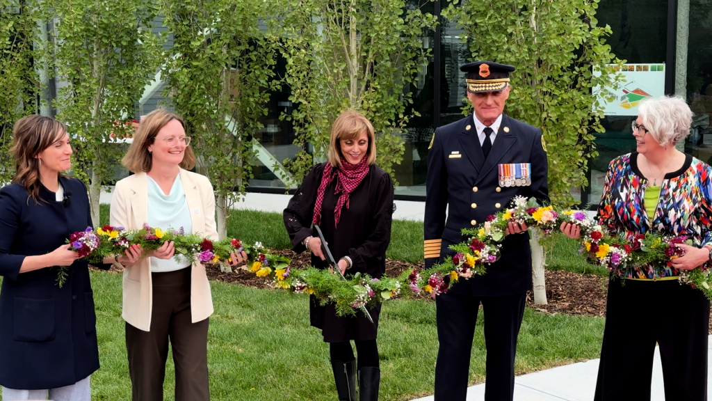 The ribbon is cut to open the Varsity Multi-Service Centre on June 25, 2025. Pictured (L to R) are Ward 1 Councillor Sonya Sharp, Calgary Housing President and CEO Sarah Woodgate, Calgary Mayor Jyoti Gondek, Calgary Fire Chief Steve Dongworth and Katie Black, City of Calgary general manager of community services.