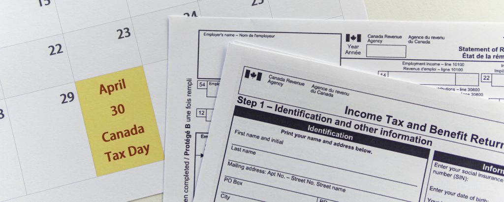 Canada Tax forms with Calendar showing Canada Tax day - April 30 Tax Deadline